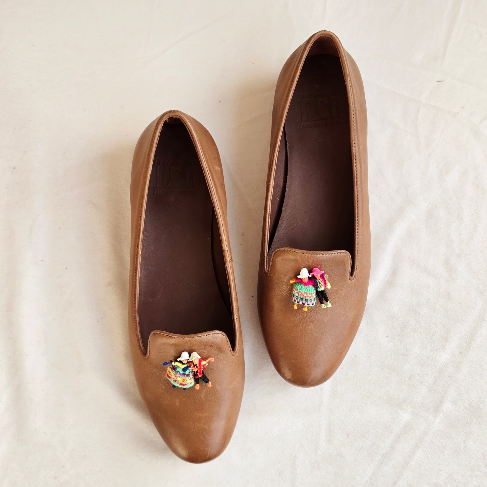 Top view of the Fortress of Inca smoking flats, showing the Andean doll details and the tan leather loafer style shoes.