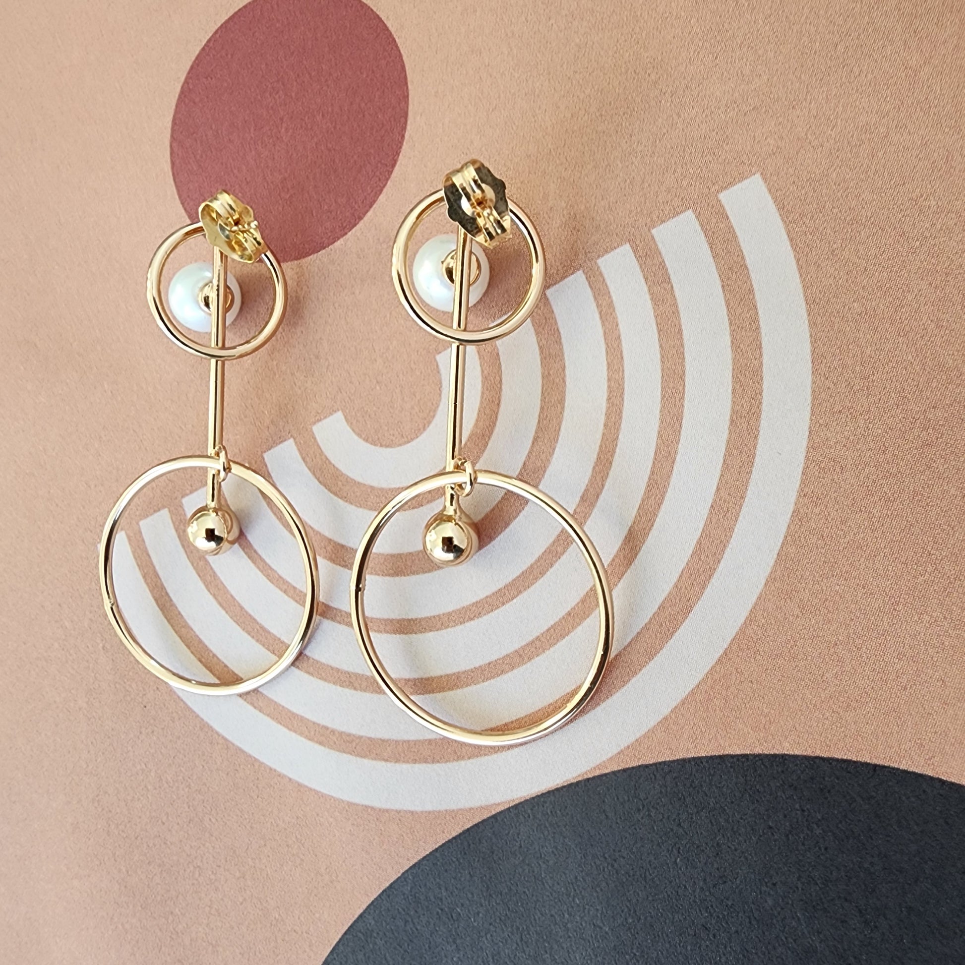 Back view of the Golden Orbits earrings with stud and butterfly closure.