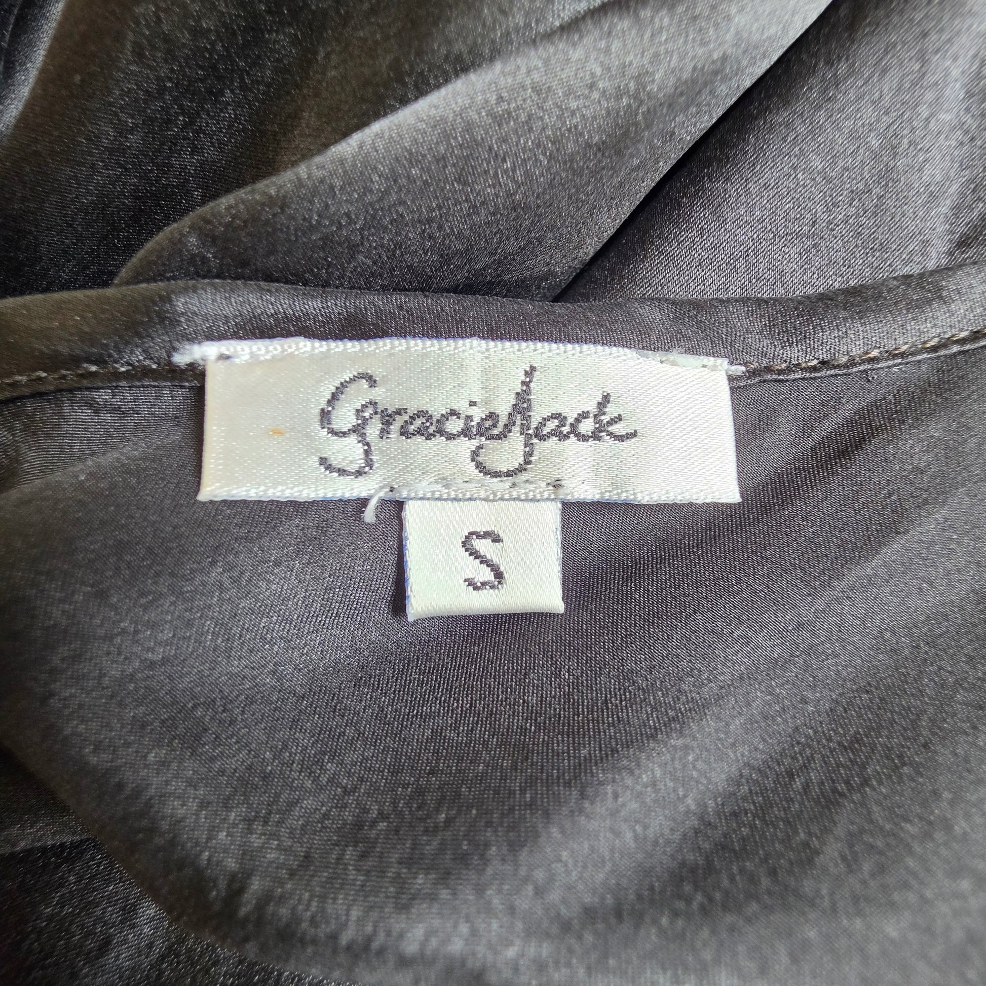 Brand label on the Gracie Jack slip dress, showing the discolouration.