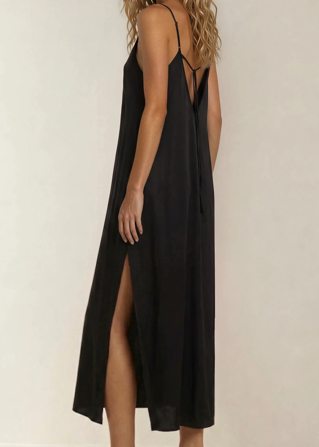 Back view of the Gracie Jack silk slip dress, showing the side splits and back tie.