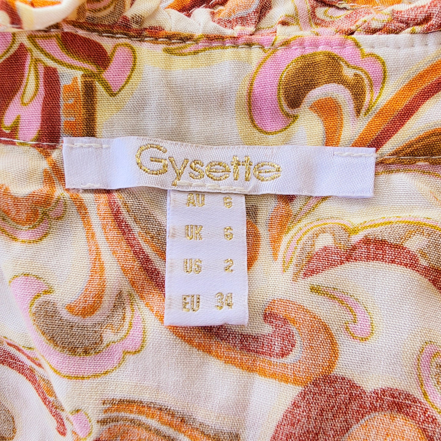 Image showing the brand of the Gysette paisley button up, long sleeve top in size 6