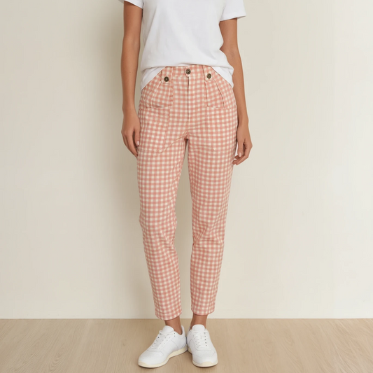 Model wearing the Kip & Co. pink gingham pants, showing the pocket detail and zip up front.