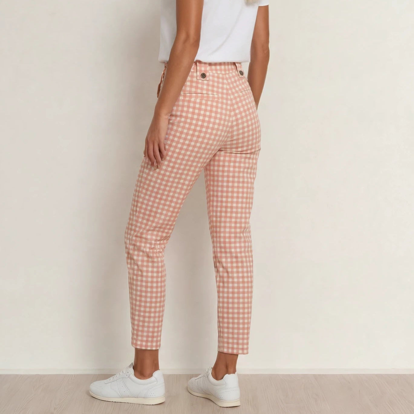 Model wearing the Kip & Co. pink gingham pants, showing the back view and cropped style