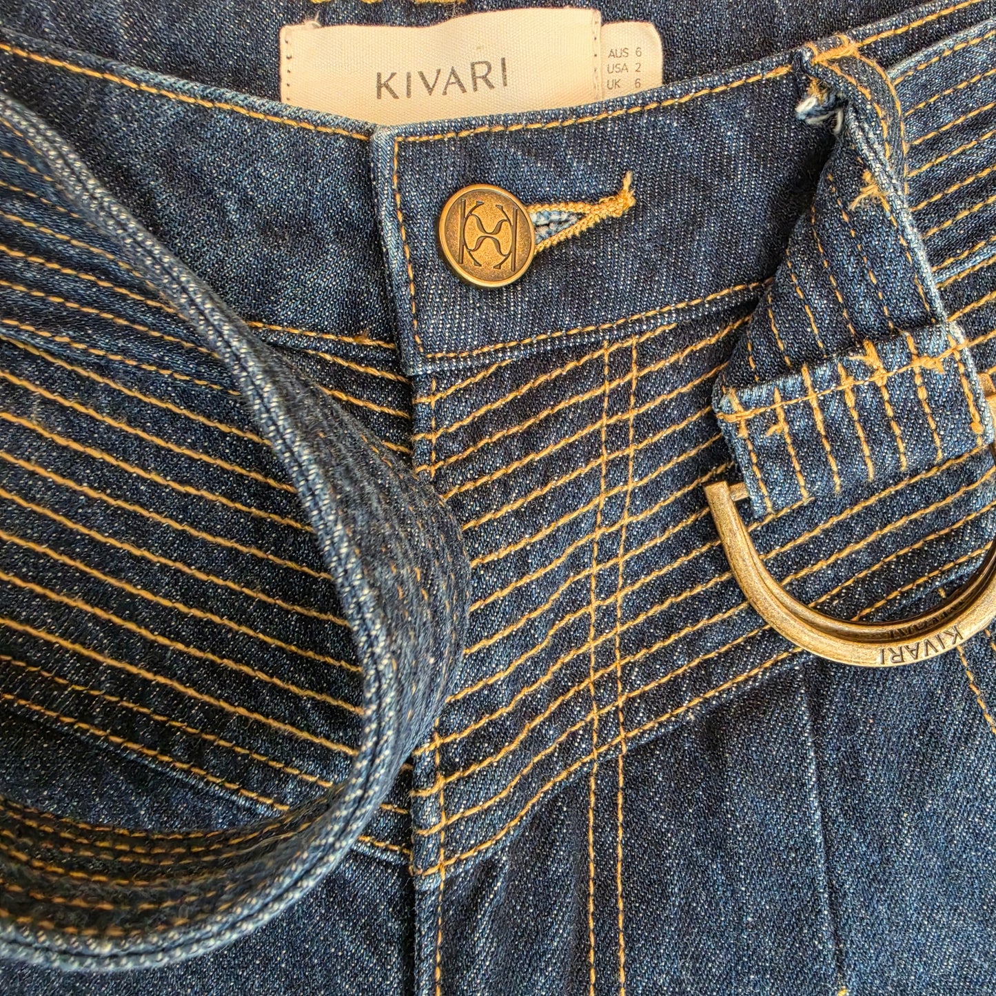 Close up view of the contrast stitching on the waistline of the Kivari Adina Jeans