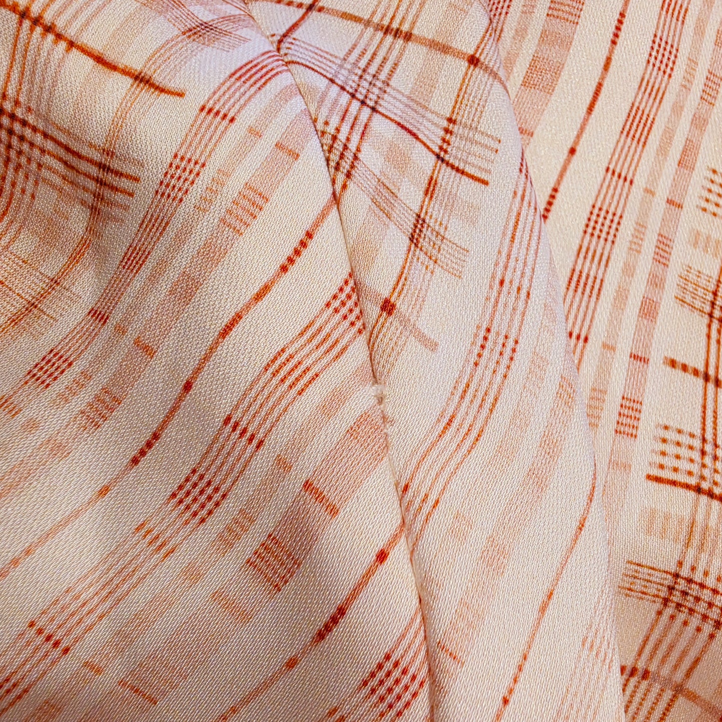 close up view of the bottom of the zip showin light wear to the threads
