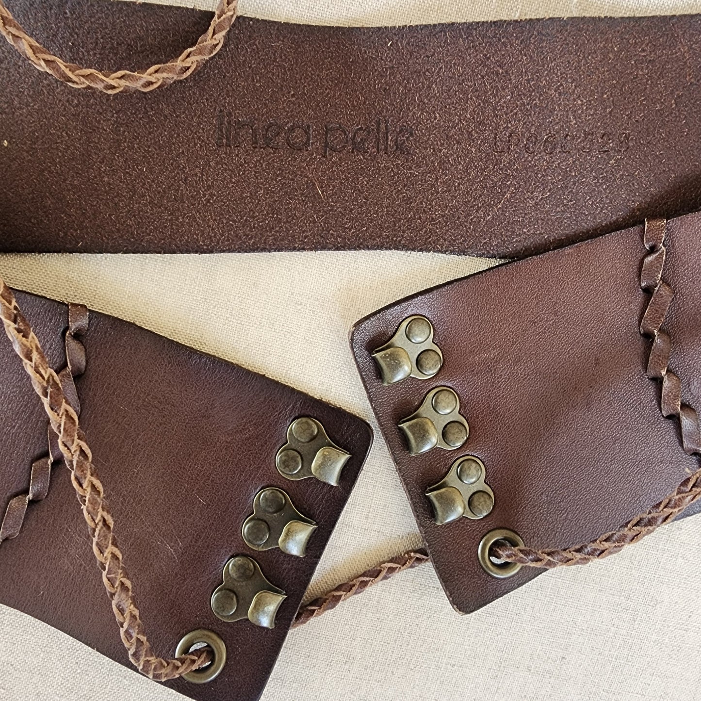 Linea Pelle embossed brand stamp on leather belt