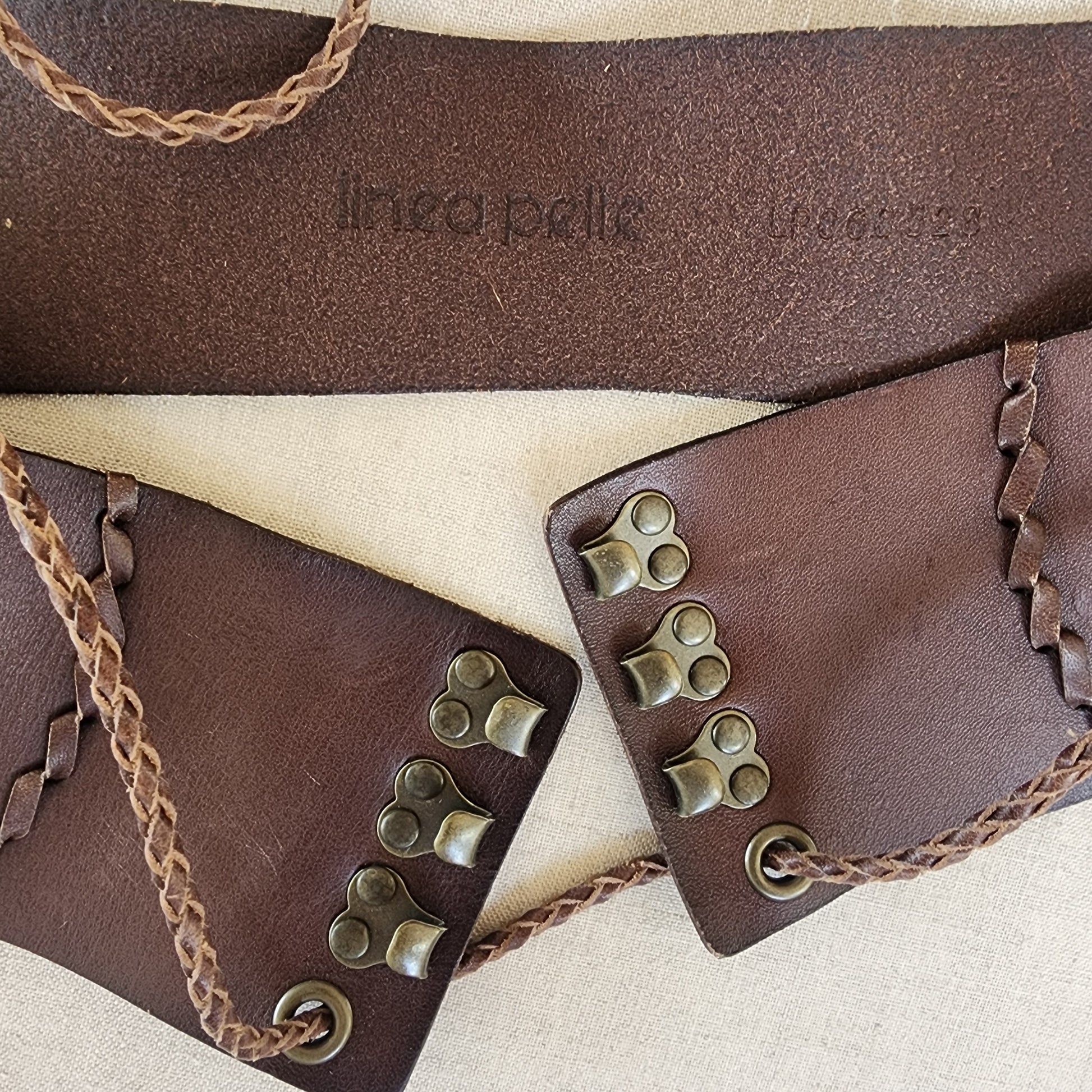 Linea Pelle embossed brand stamp on leather belt