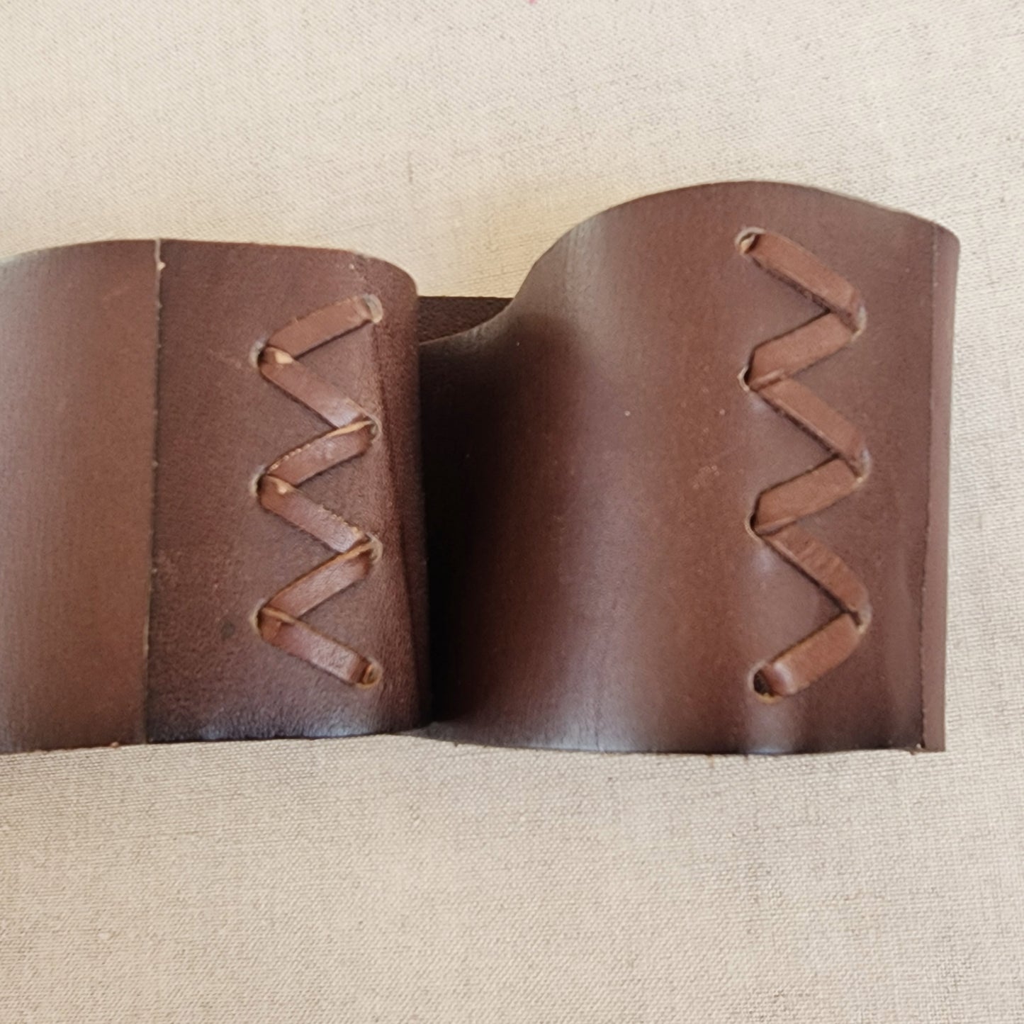 Close up of Linea Pelle wide belt side stitching details