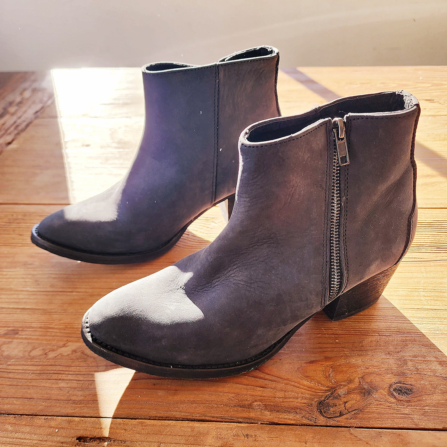 Left-side angle of the Maya McQueen grey suede boots, showing the curved silhouette and low western-style heel.