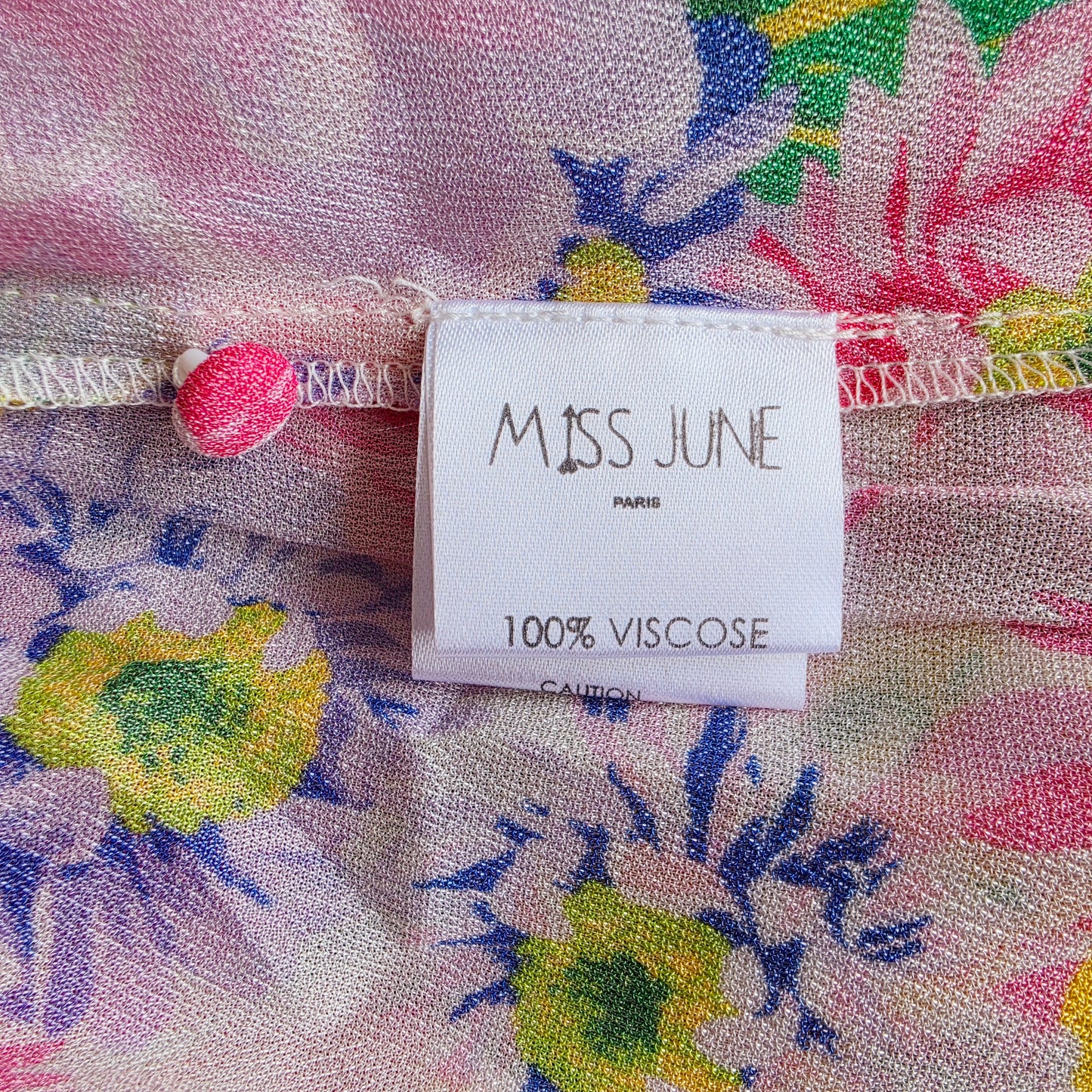 Miss June Paris brand label and 100% viscose fabric composition label inside the Holly floral maxi dress.