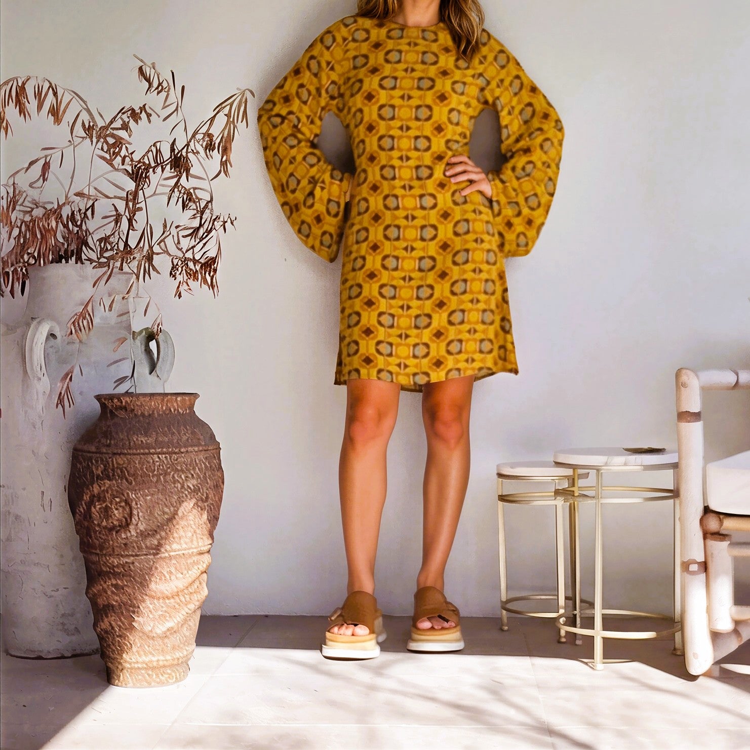 Front view of model wearing the Nine Lives Bazaar Quincey Mini Dress in retro print, with long bell sleeves