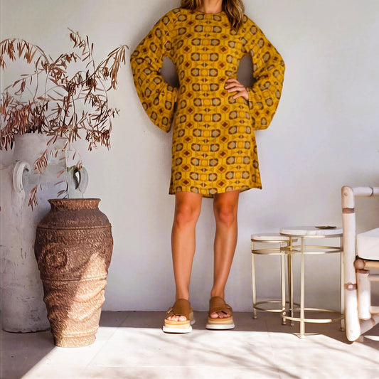 Front view of model wearing the Nine Lives Bazaar Quincey Mini Dress in retro print, with long bell sleeves