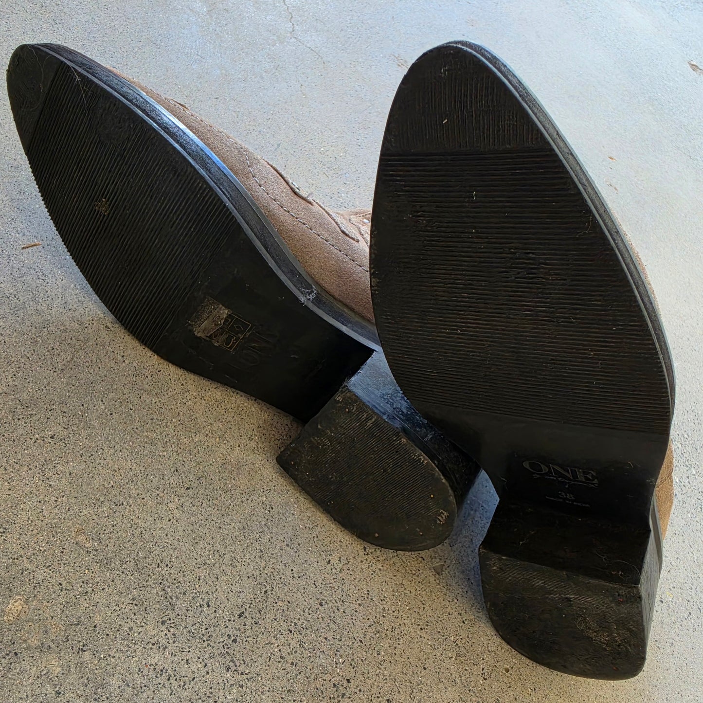 Sole view of One Teaspoon suede ankle boots showing light wear and stacked heel