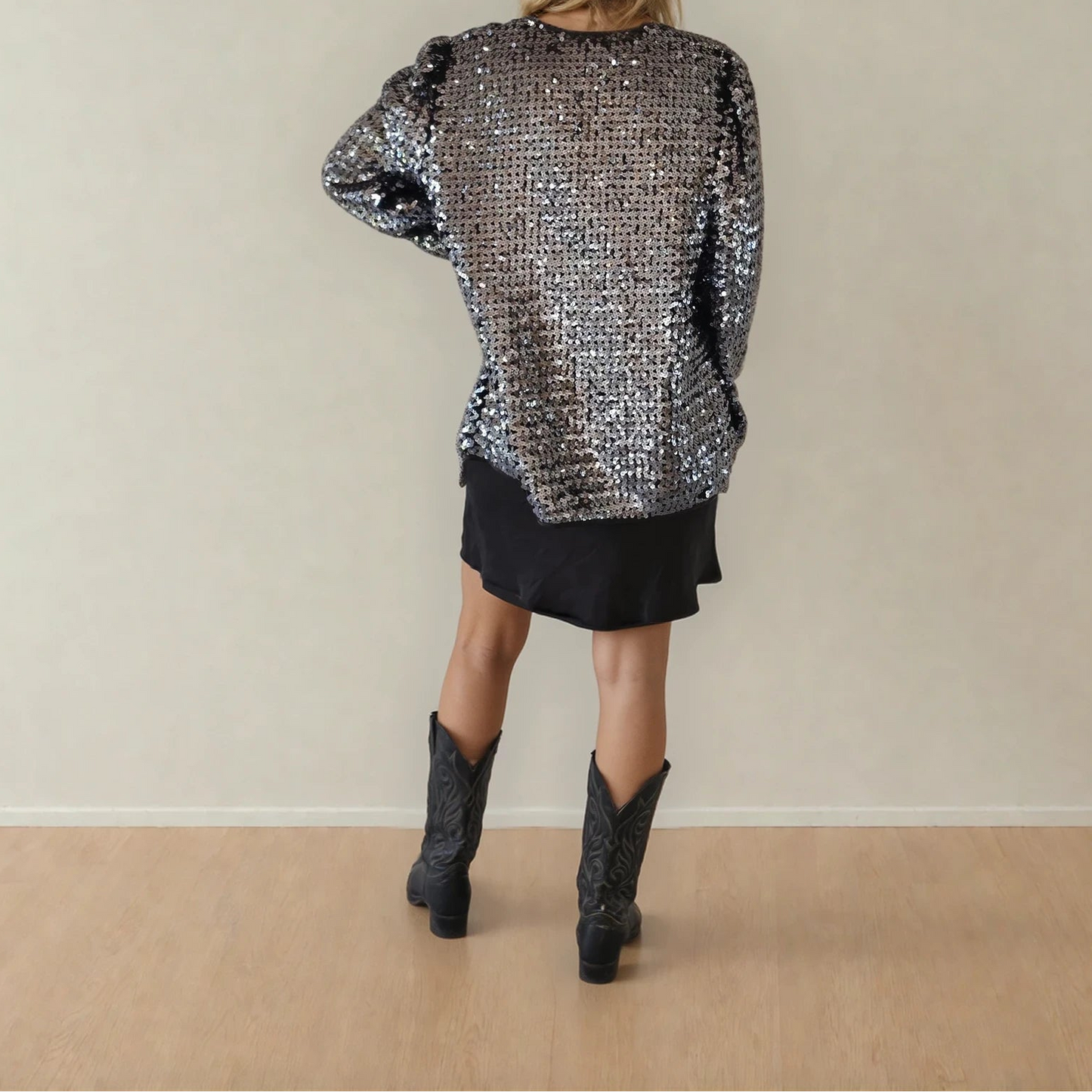 Back view of vintage Peer Gynt sequin jacket with full sequin coverage and loose silhouette.