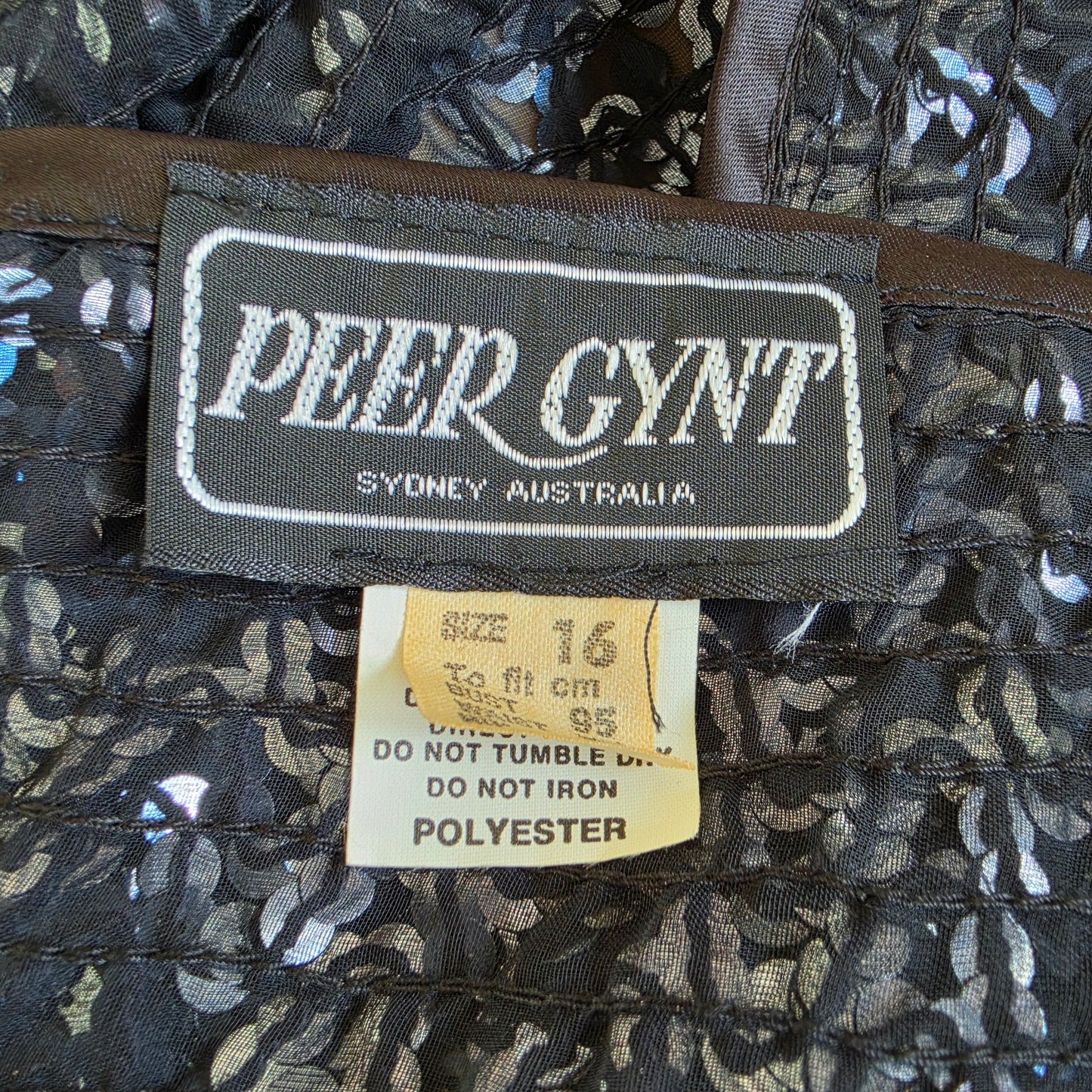 Peer Gynt vintage label inside sequin jacket showing brand details.