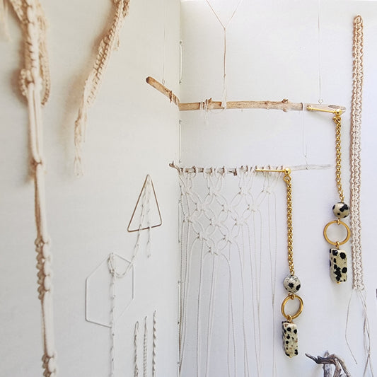 Image showing the gold plated Prairie earrings with dalmatian jasper suspended from gold chain, handmade by Wilson Avenue.