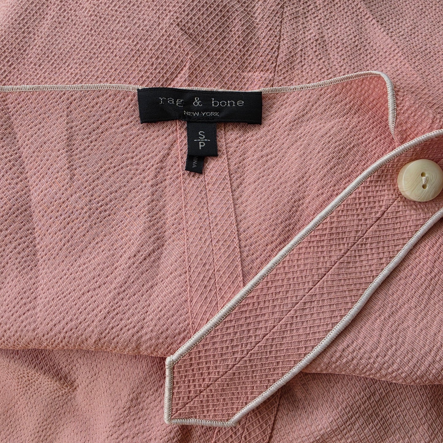 Image showing the brand label and concealed adjustment holes on the Rag & Bone Tia Tank Top.