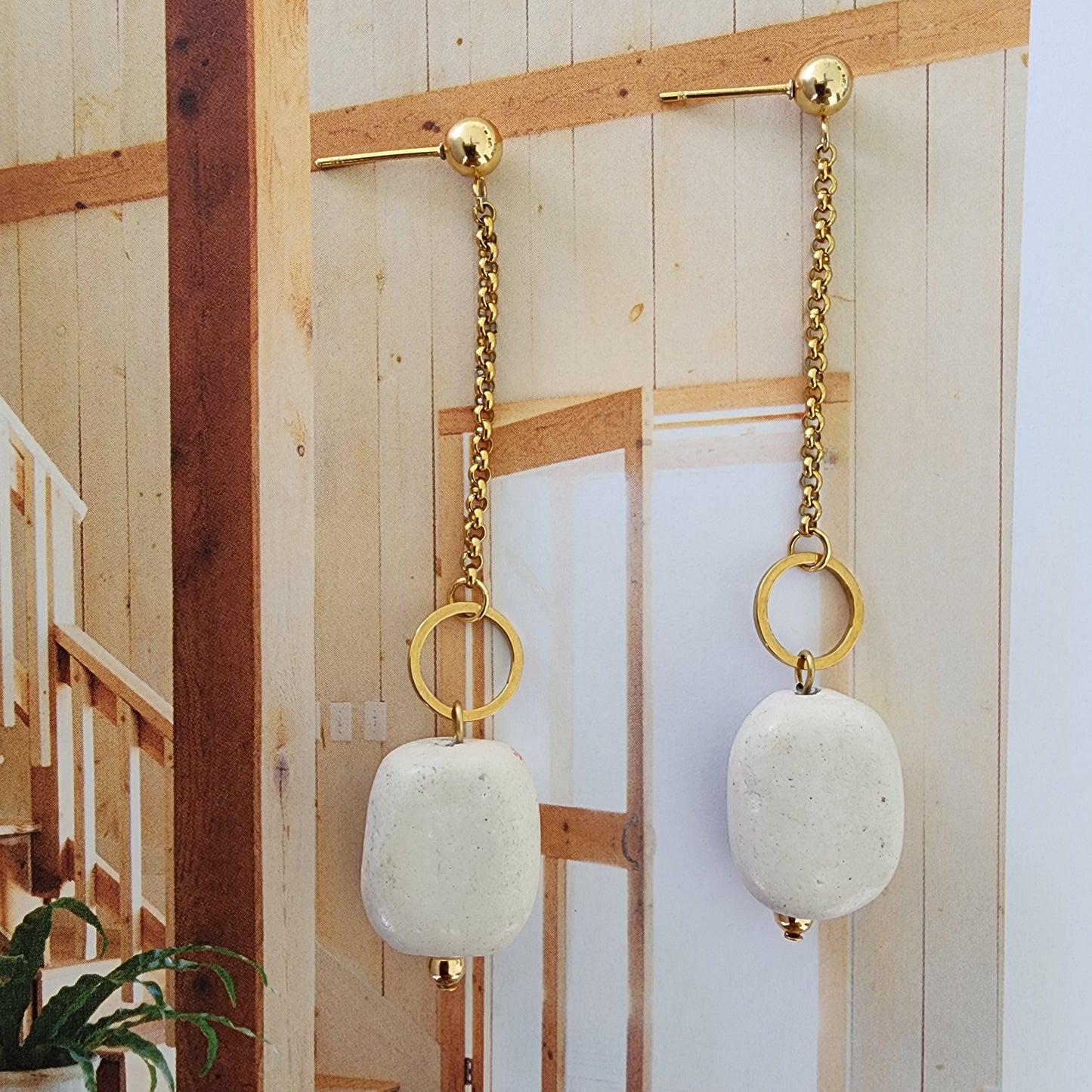 A close up image showing the Balance handmade earring's natural texture with gold plated chain and components, by Wilson Avenue.