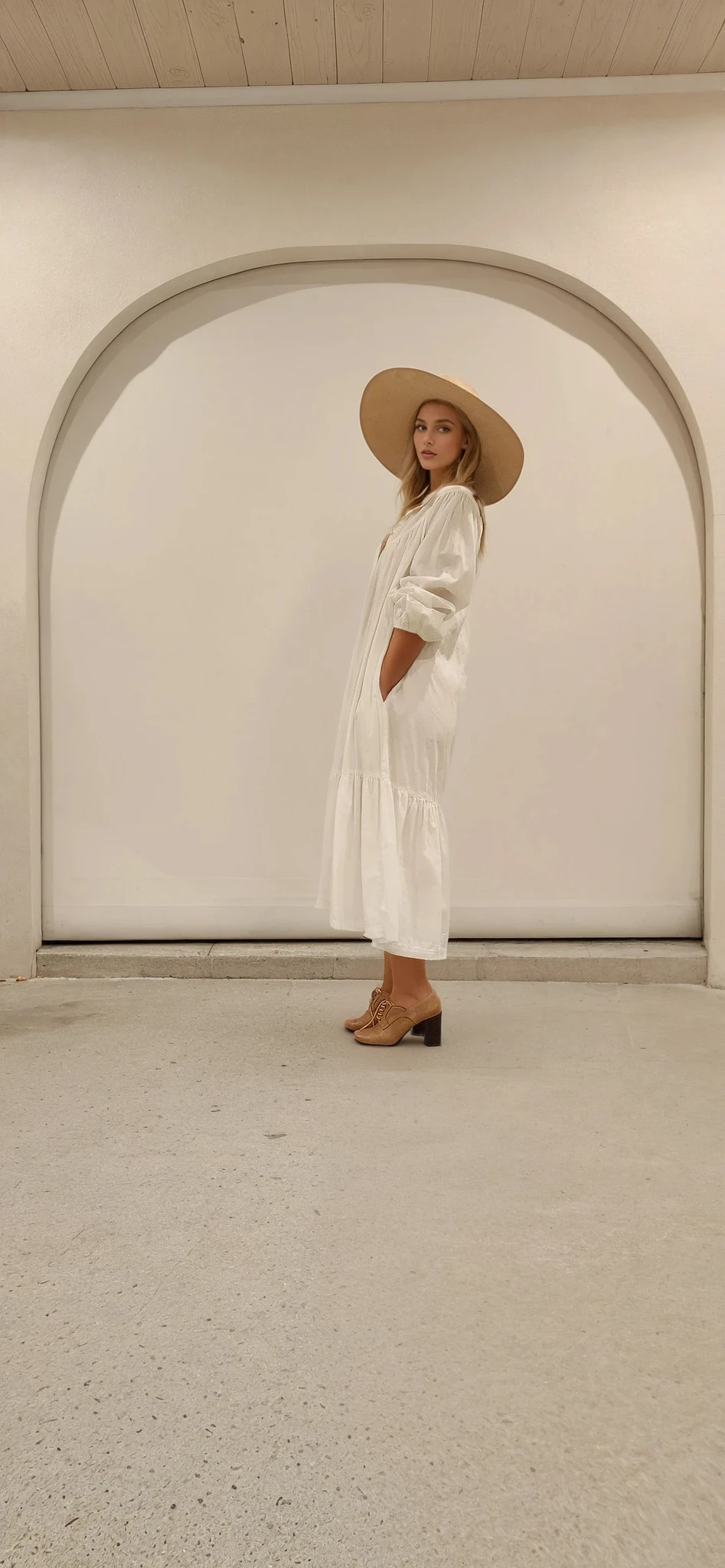 Side view of flowy Rowie maxi dress with tiered hem and gathered shoulder details