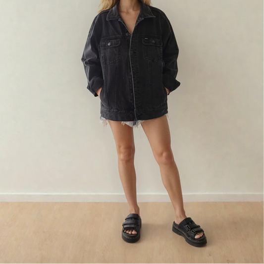 Black RVCA denim jacket worn oversized, faded wash with front button closure and chest pockets