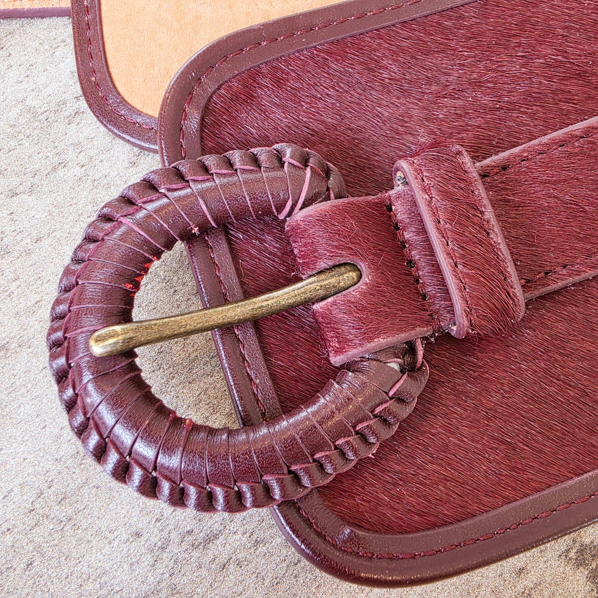 Close up of the Saa & Bide pony hair belt showing the imperfection on the leather braided buckle.