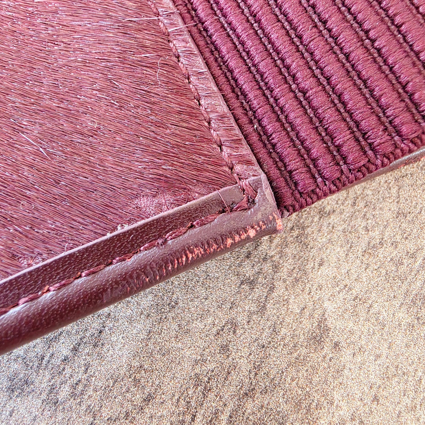 Close up of the leather rubbing and some missing horse hair on the Sass & Bide western belt.