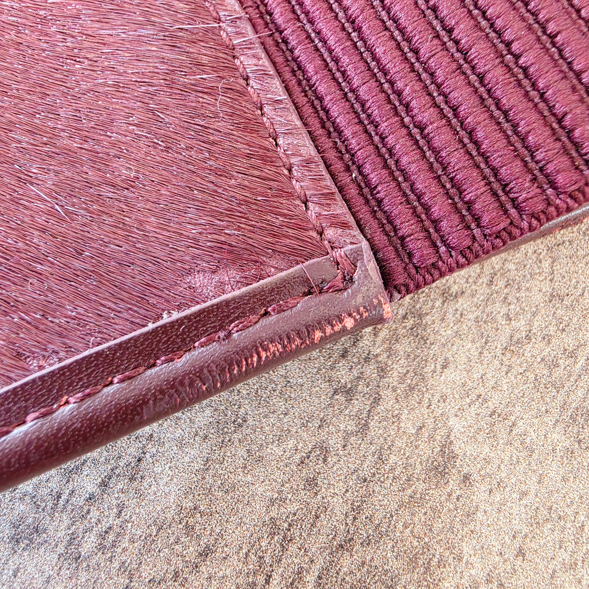 Close up of the leather rubbing and some missing horse hair on the Sass & Bide western belt.