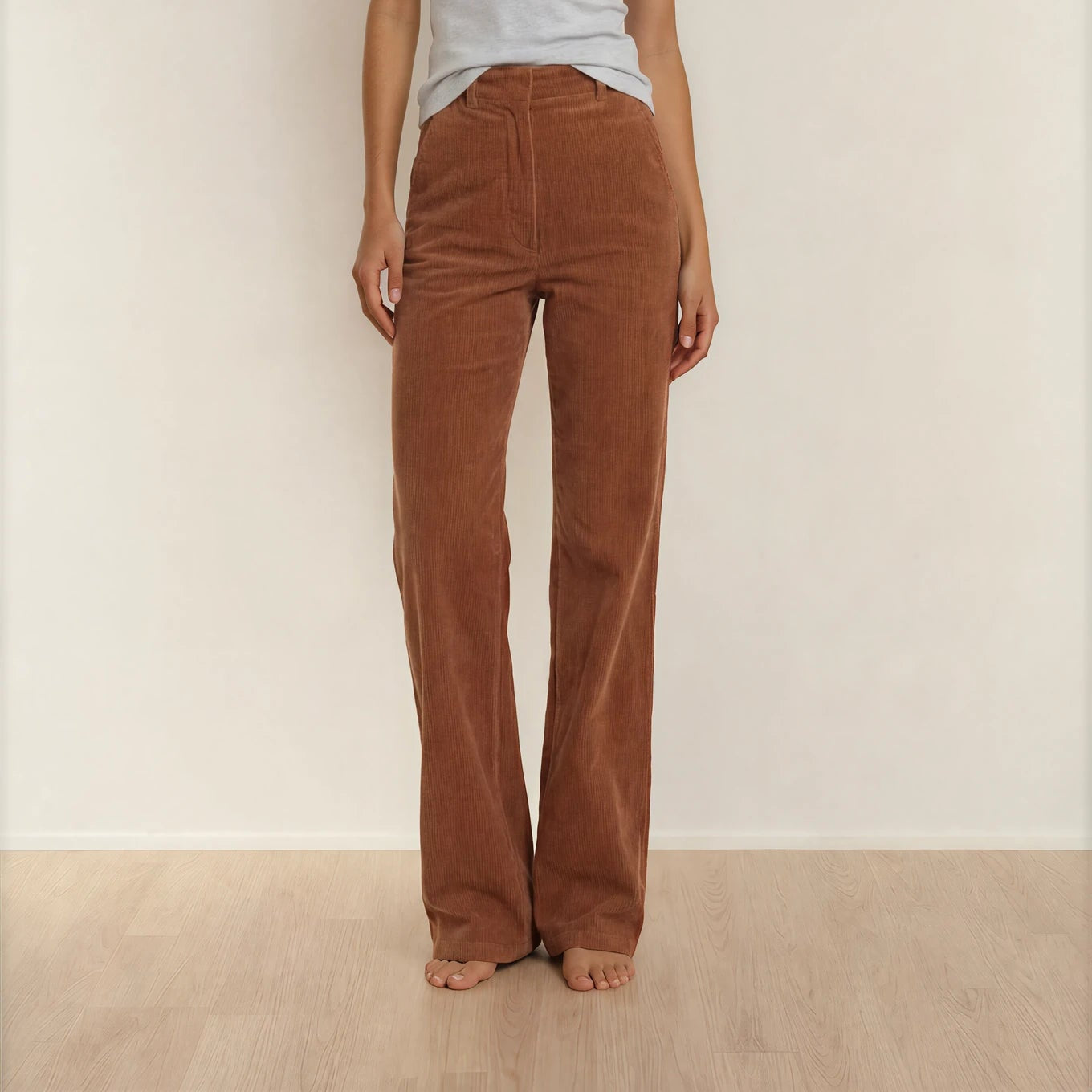 Front view of the Scanlan Theodore rust coloured Corduroy pants, showing the zip closure and belt loops.