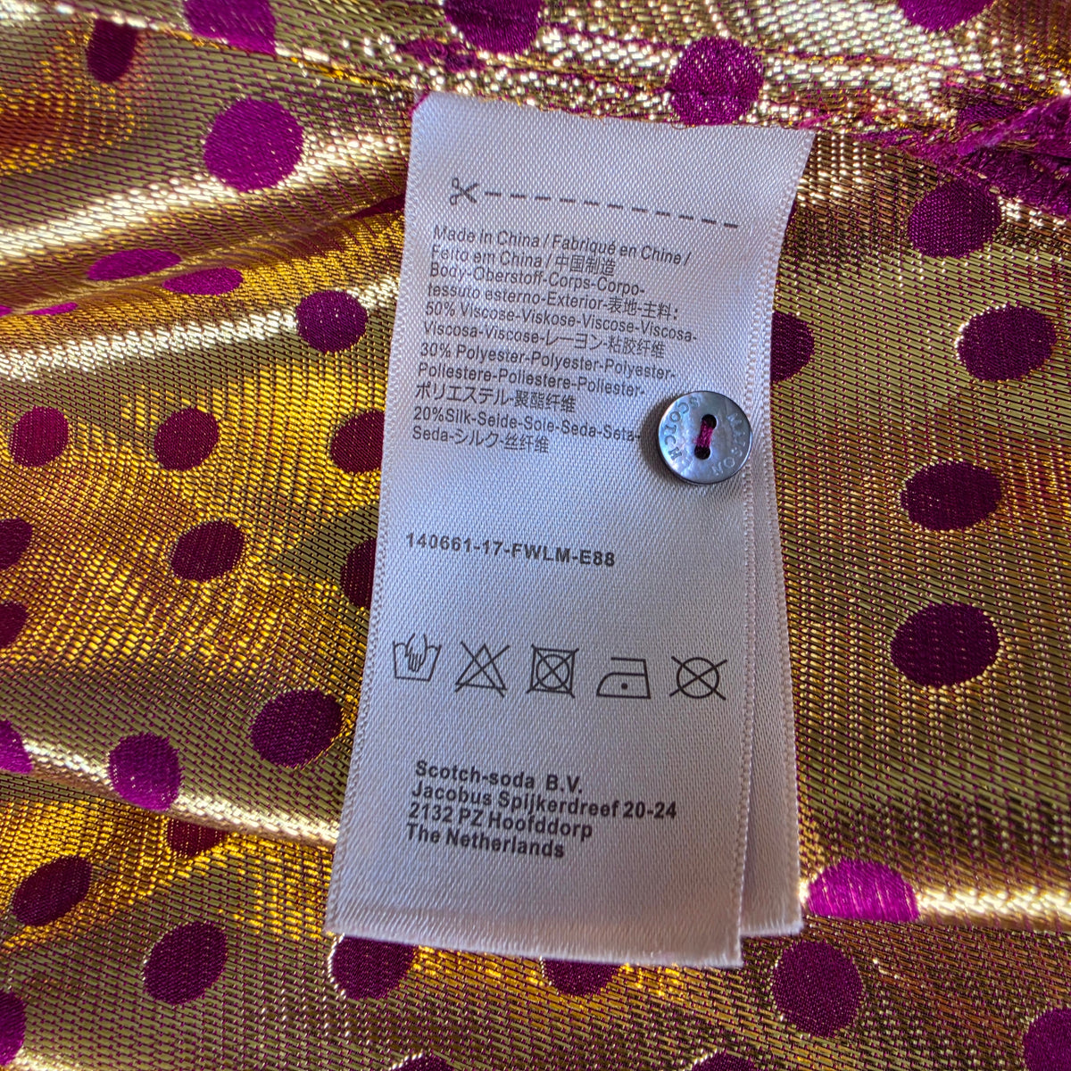 Scotch & Soda Magnifique fabric composition label showing viscose, polyester and silk blend.