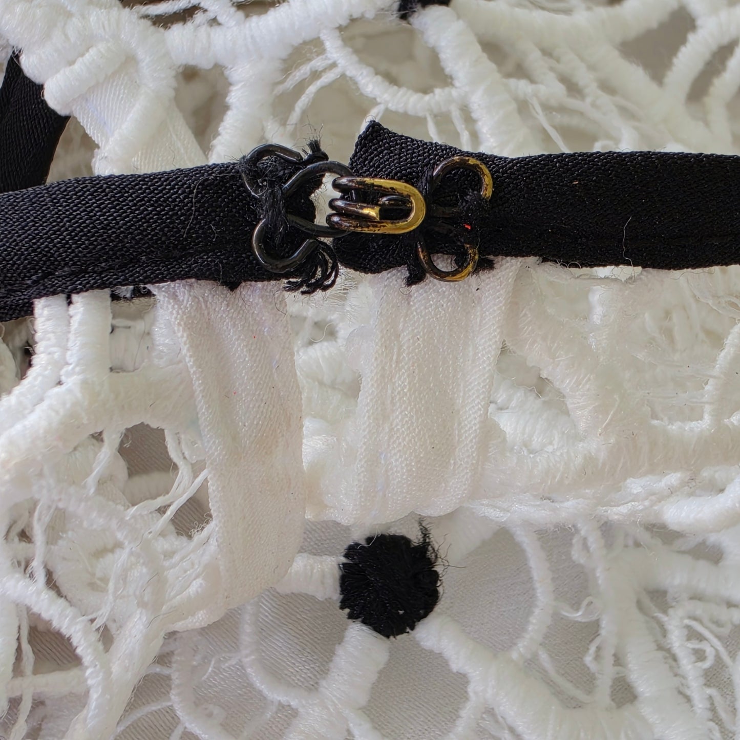 Close-up view of the hook & eye closure on the Self Portrait Hibiscus dress.