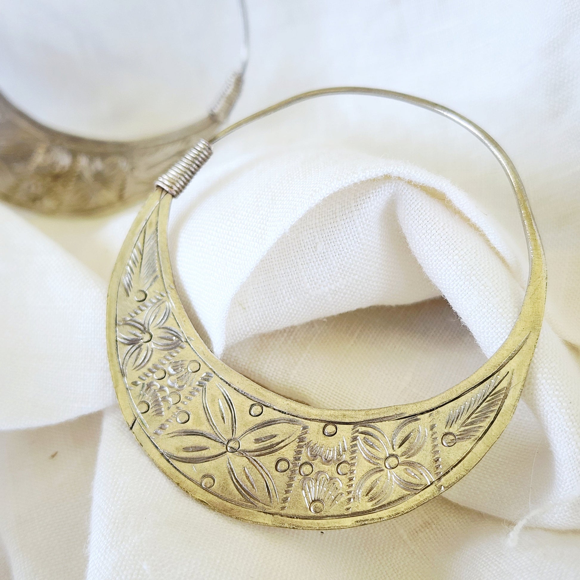 Close-up of the Silver Strays hoops, highlighting the etched crescent pattern and softly oxidised silver finish.