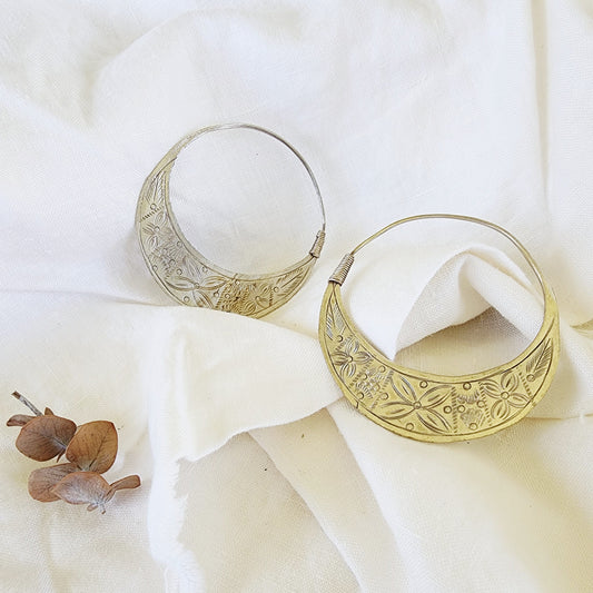 Front view of the Silver Strays etched crescent hoops, showing the oxidised, silver-worn patina and artisan detail.