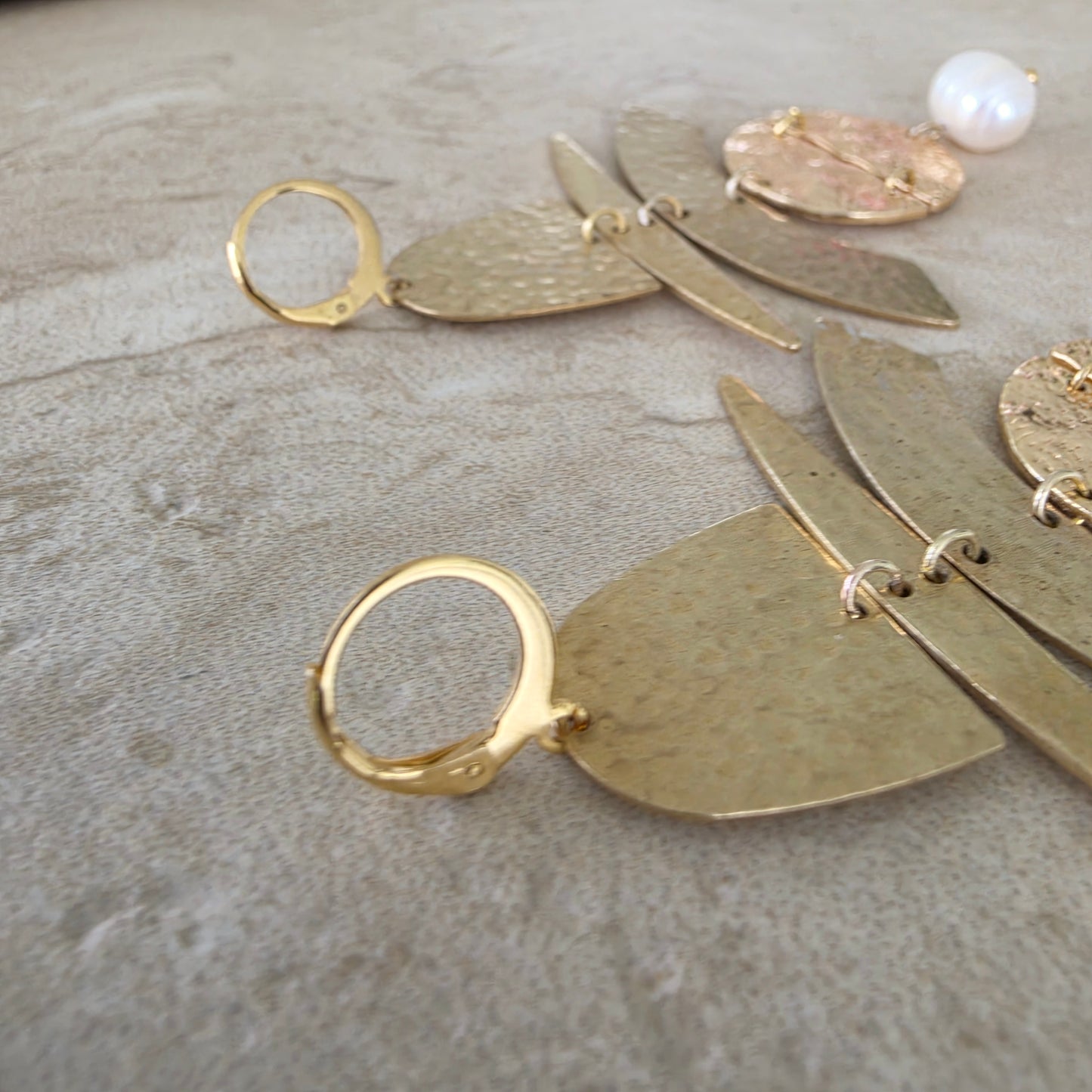 Close up of the gold plated earring closure of the handmade Skupiti earrings.