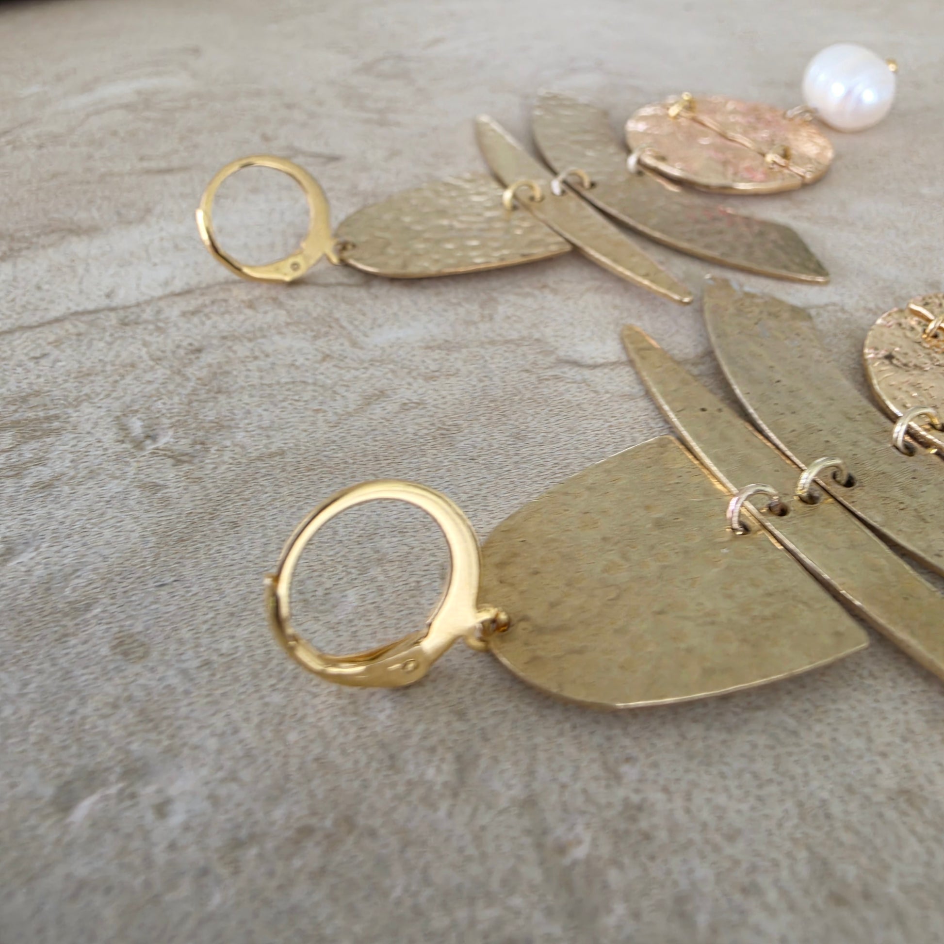 Close up of the gold plated earring closure of the handmade Skupiti earrings.