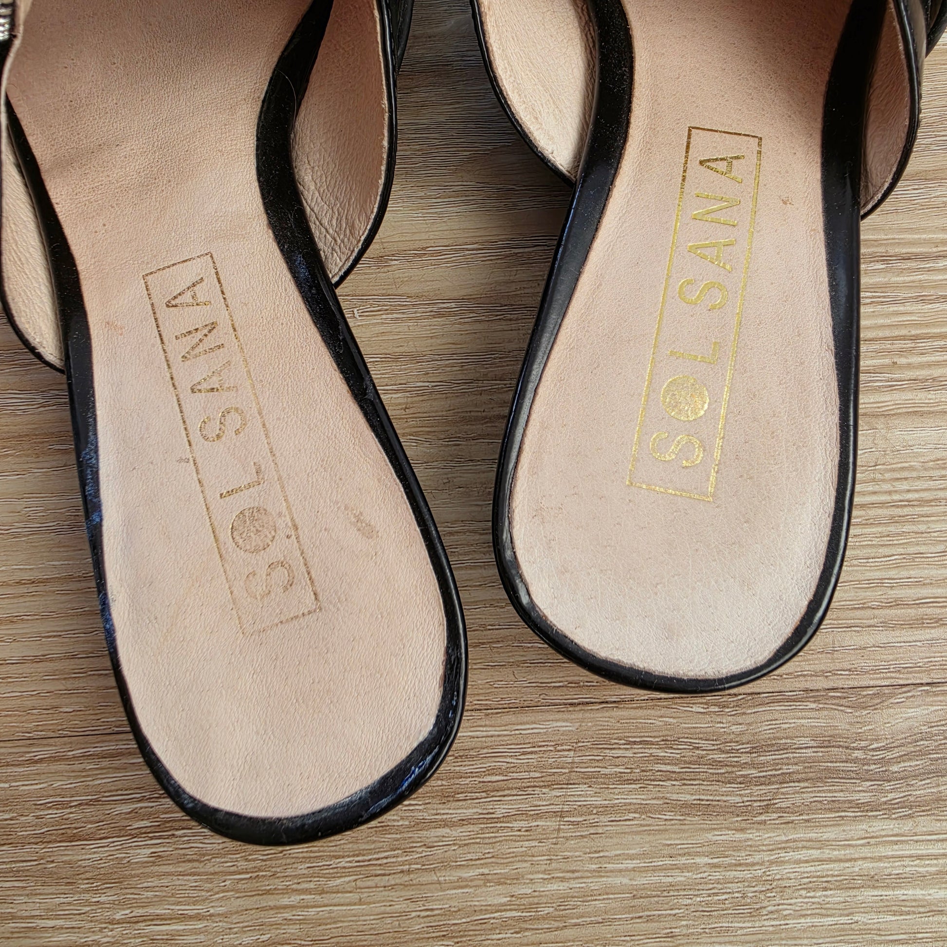 Inner sole of Sol Sana Sadie slides with gold logo and light wear marks