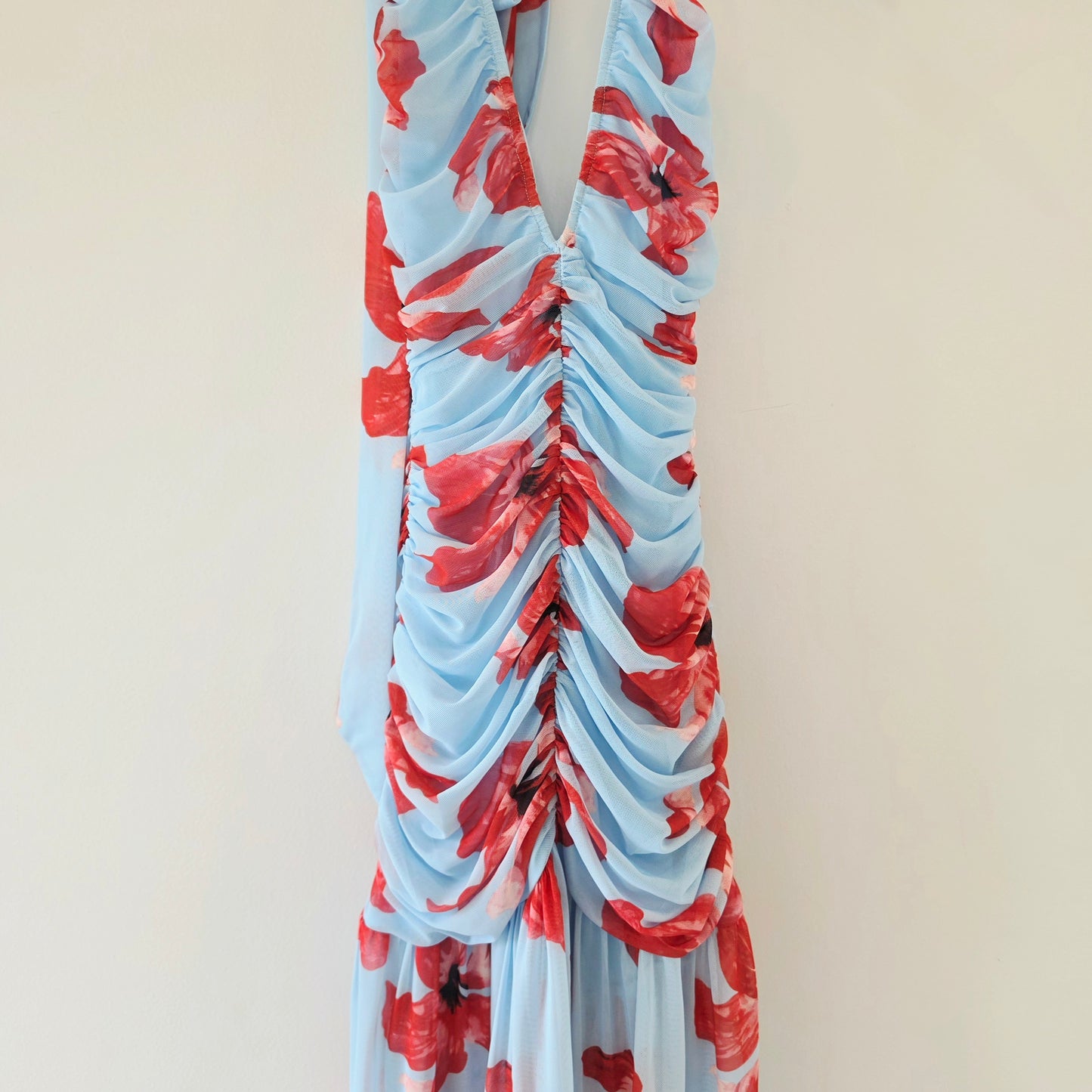 Suboo Chloe floral halter maxi dress with red floral print, ruched bodice and plunging neckline.