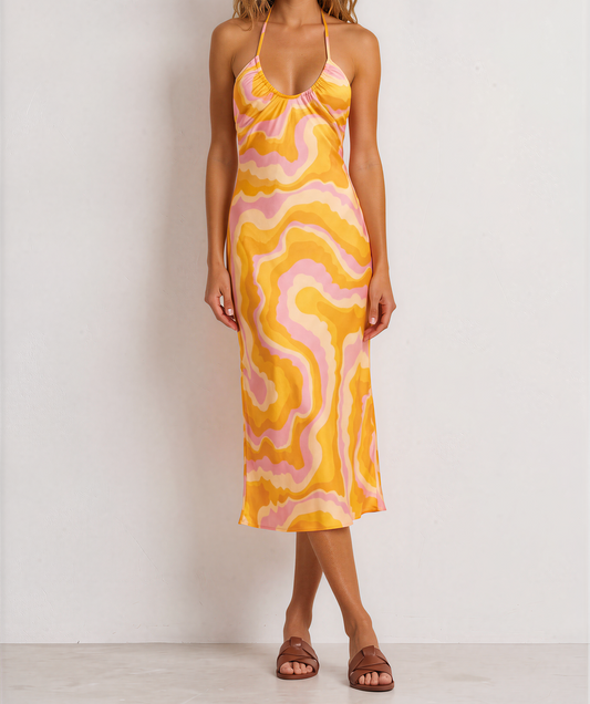 Front view of model wearing the Suboo Cloud Keyhole Dress, showing the retro swirl pattern in pink, orange, yellow and beige