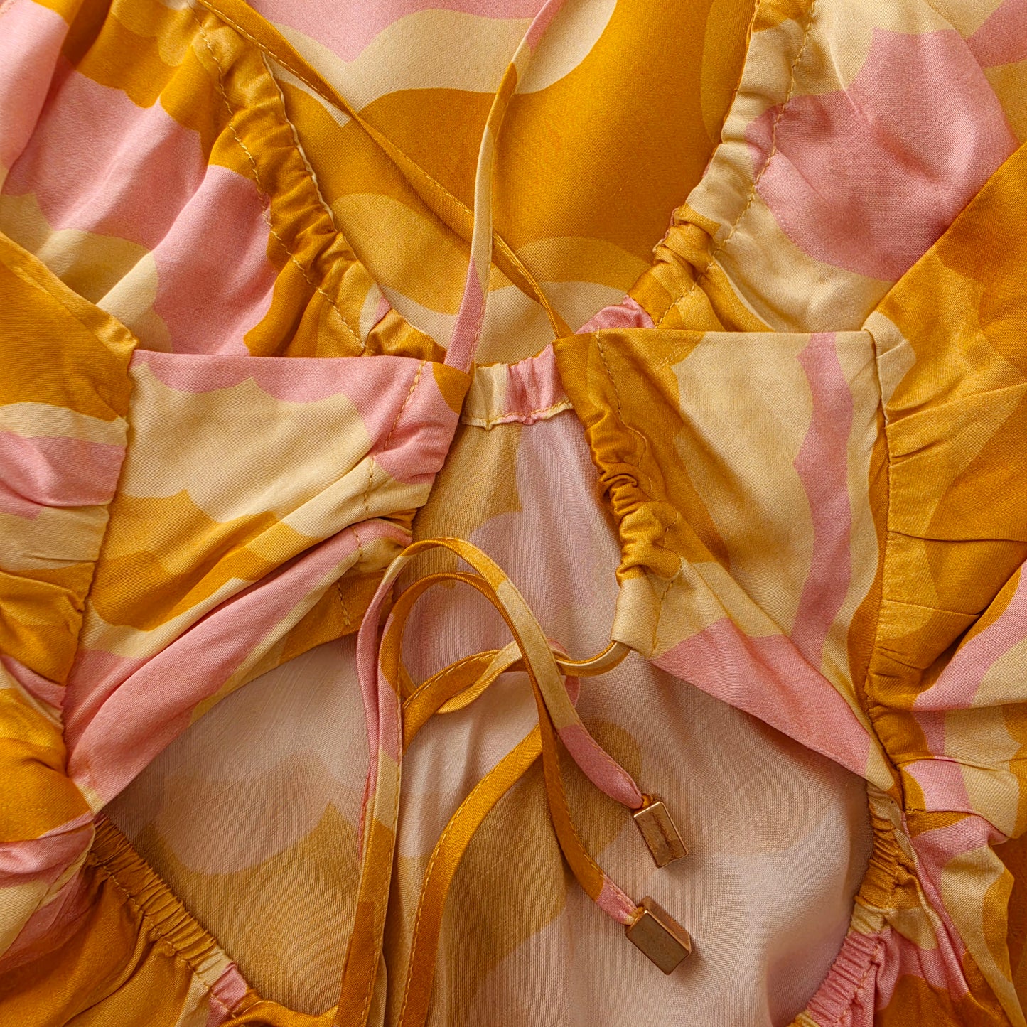 Close up of the back adjustable tie straps on the Suboo Cloud Keyhole Slip Dress.