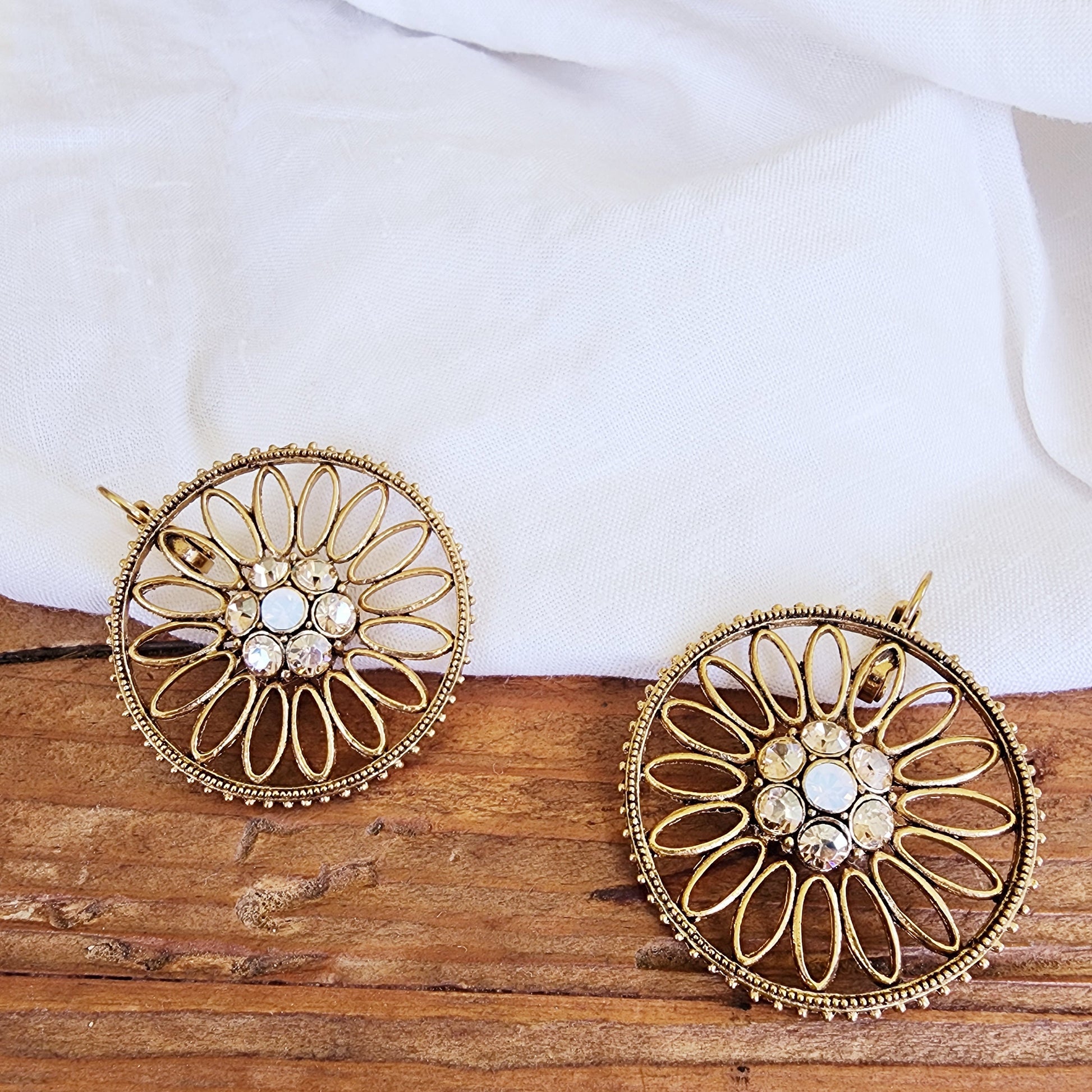 Front view of the Sunflare earrings showing the clasp and gold-tone finish.