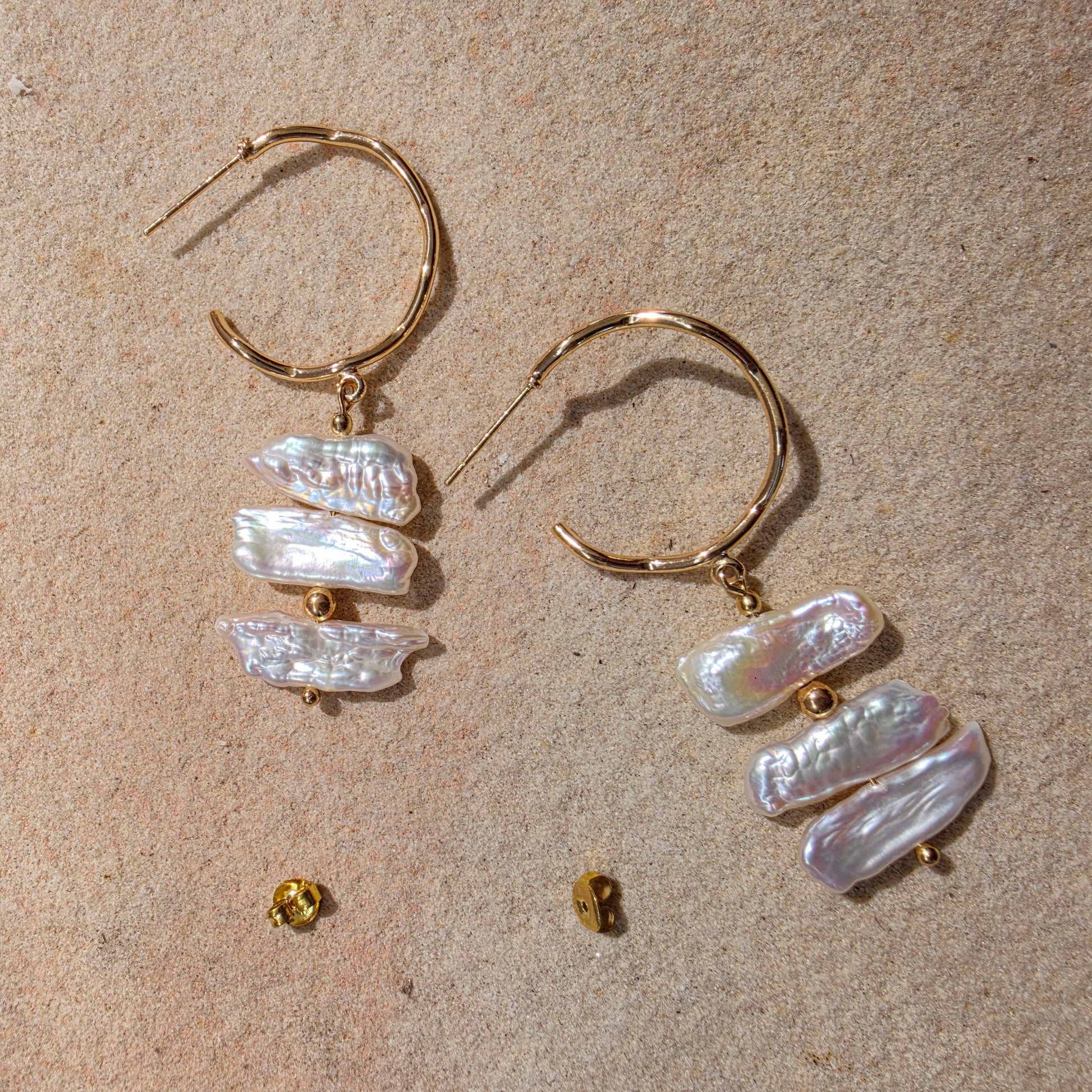 Front view of the Tide handmade pearl earrings, showing the bright sheen and irregular shape of the pearls.