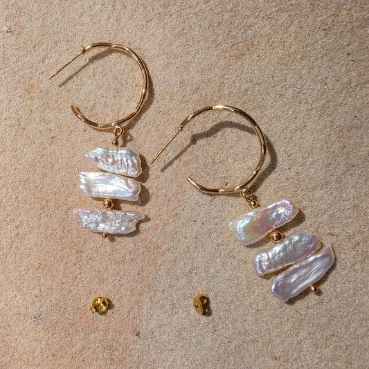 Front view of the Tide handmade pearl earrings, showing the bright sheen and irregular shape of the pearls.