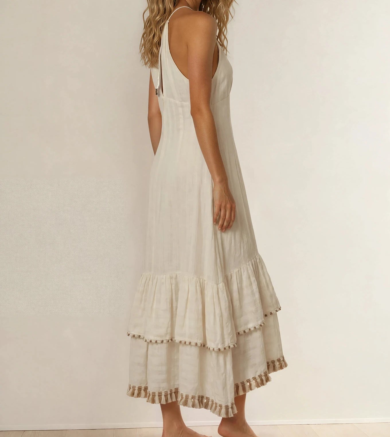Back view of the Tigerlily Avari maxi dress showing the beaded and fringe detailing on the tiered hem