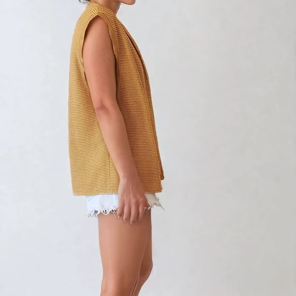 side view of the vintage Ara Modell top, showing the textured fabric and medium length.