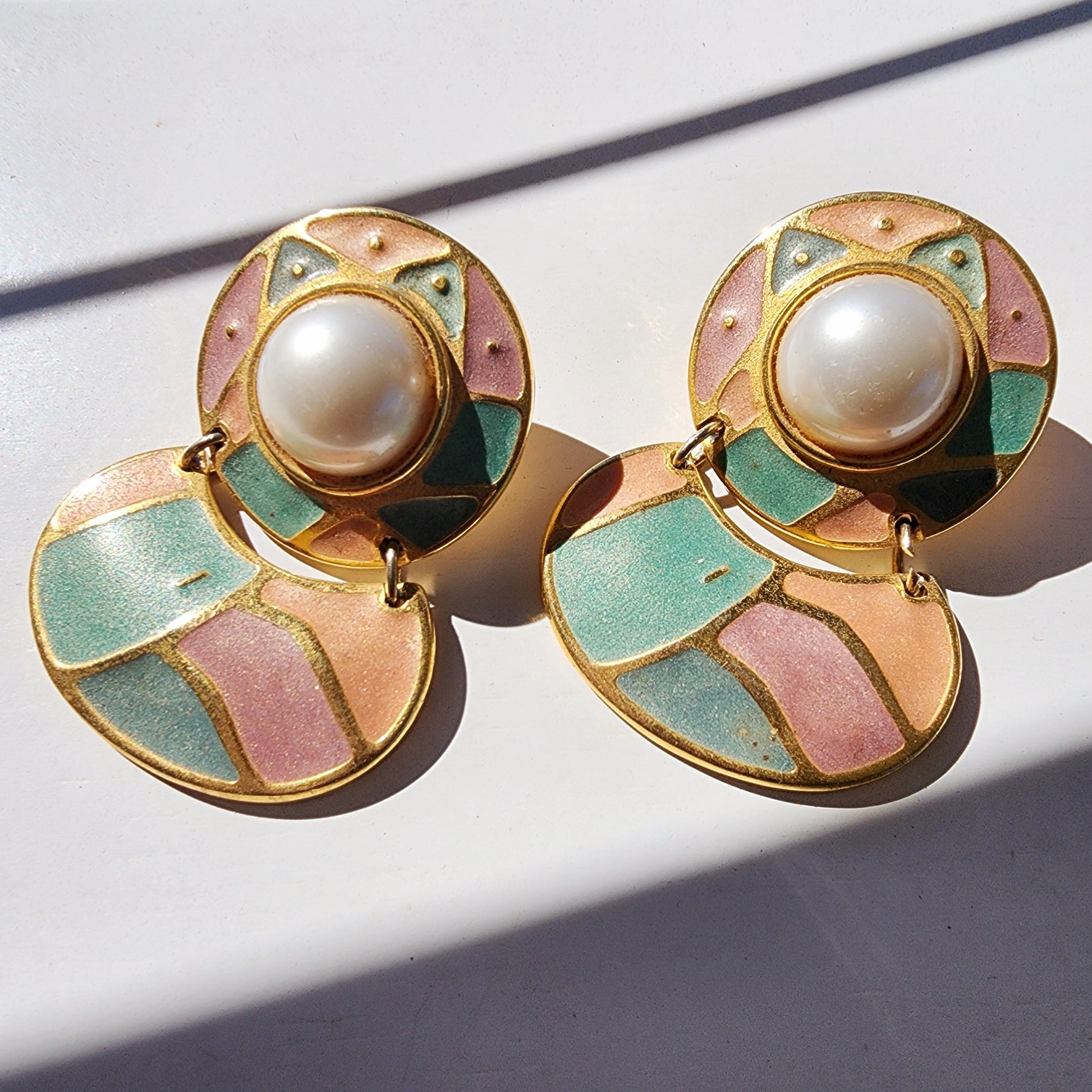 Pair of Berebi statement earrings with large faux pearl and enamel details in pink, green, and gold