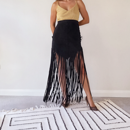 Front view of the vintage long fringe suede skirt, showing the V style hem falling into ankle length fringe.