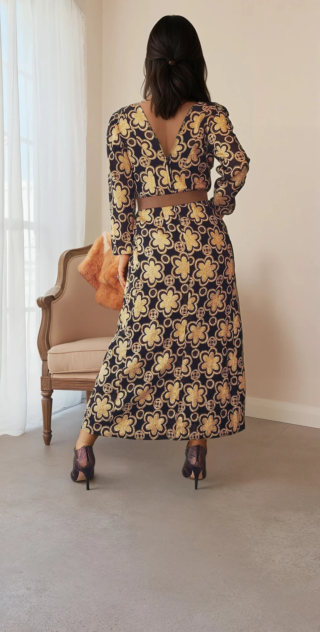 Rear view of the dress with a deep V-shaped back neckline, highlighting the full floral print across the length of the garment
