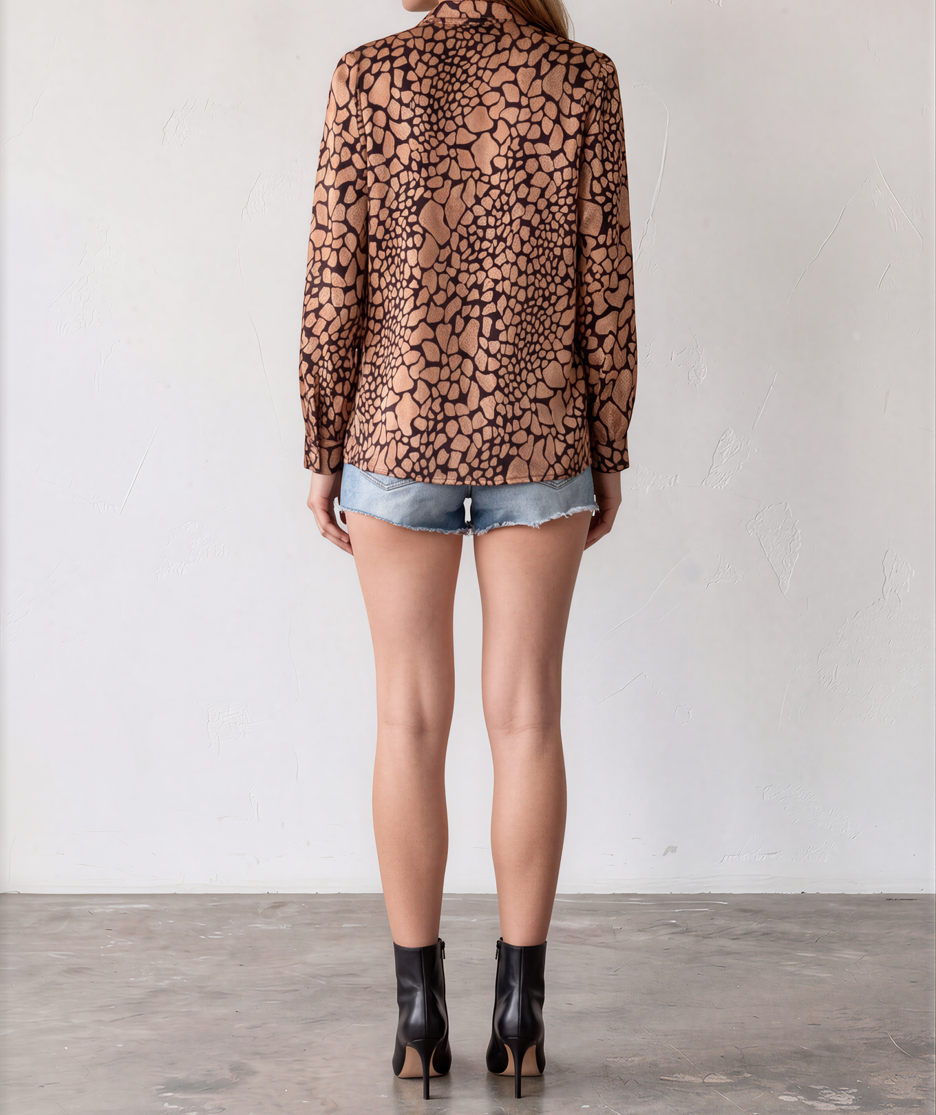 Back view of vintage Katie's metallic bronze and black abstract animal print long sleeve button-up shirt.