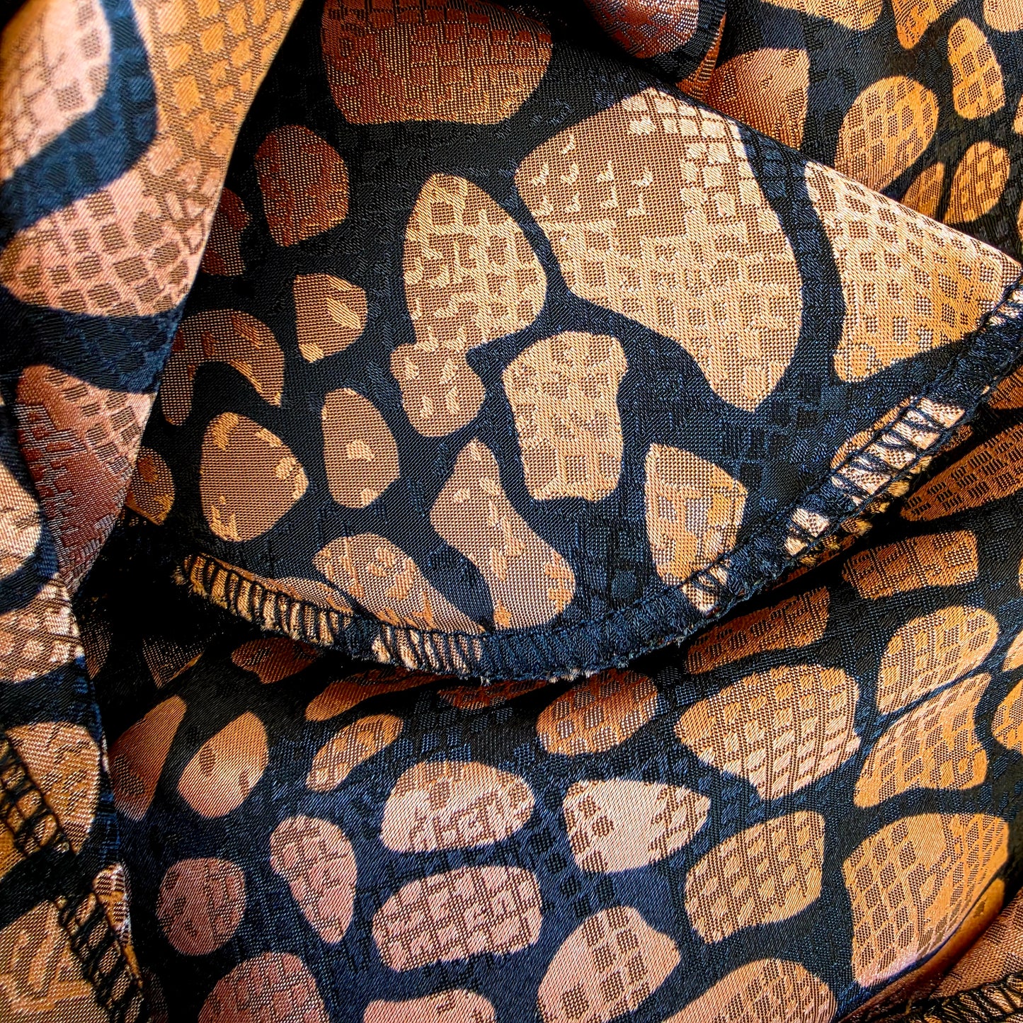 close up of the shoulder pad on the Vintage Katies animal print blouse