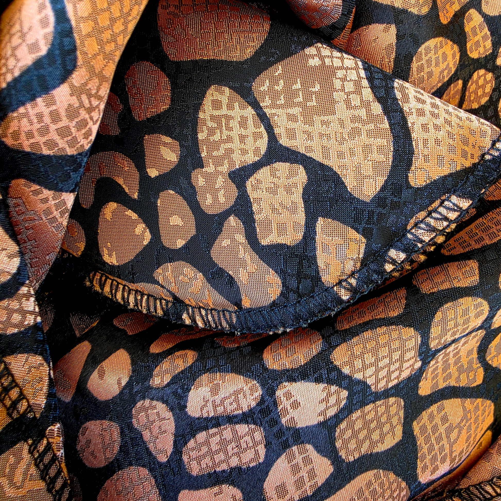 close up of the shoulder pad on the Vintage Katies animal print blouse