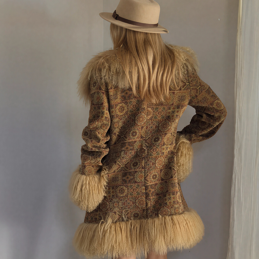 Back view of the Vintage Penny Lane Tapestry Coat with Mongolian Lamb wool trim, showing the dramatic bohemian style and striking print